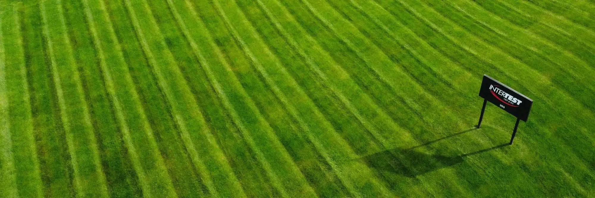 InterTest About Us sign and front lawn