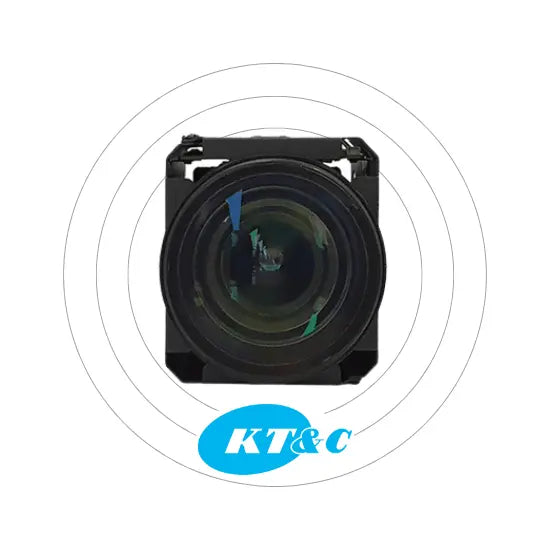Camera lens with KT&C logo on a white background