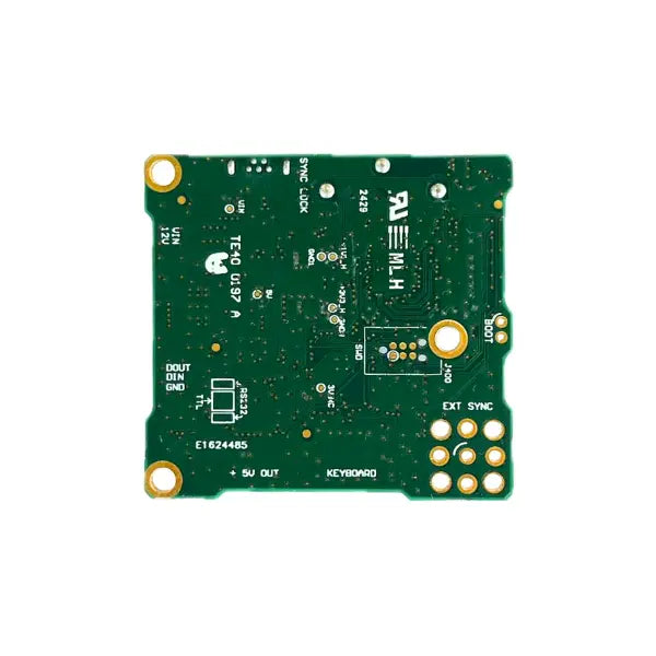 Green electronic circuit board with various components on a white background