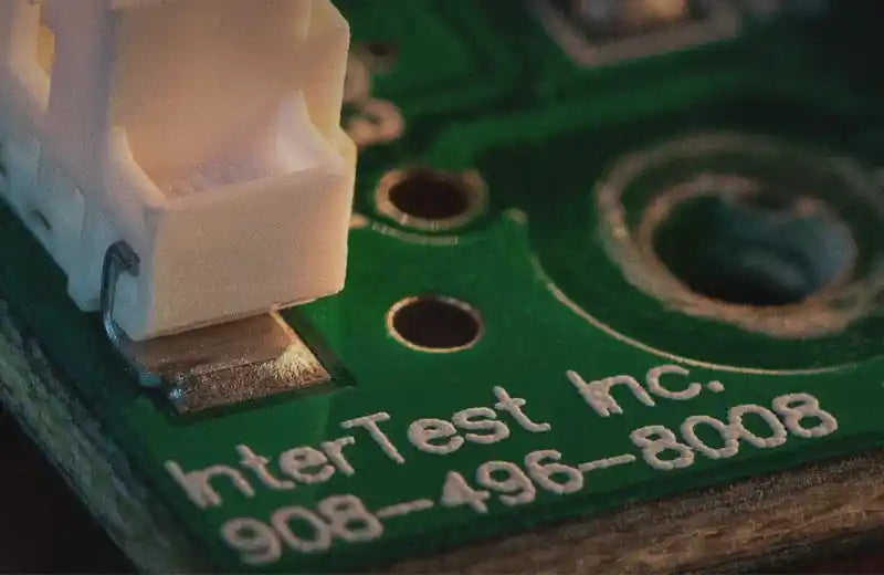 InterTest Interface board with logo and phone number- InterTest