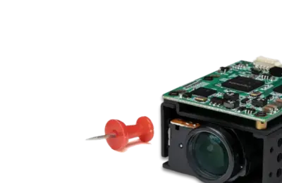 small block camera with a red thumb tack