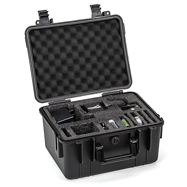 Black protective case with foam interior containing electronic camera devices on a white background